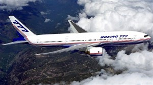 Boeing_777_above_clouds,_crop